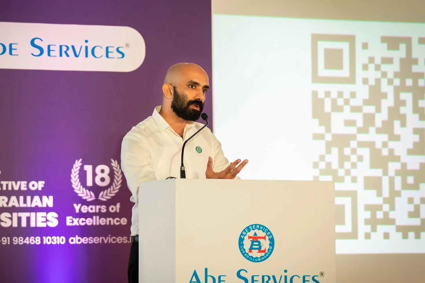 Josbin Itty speaking at an Abe Services event in Kochi
